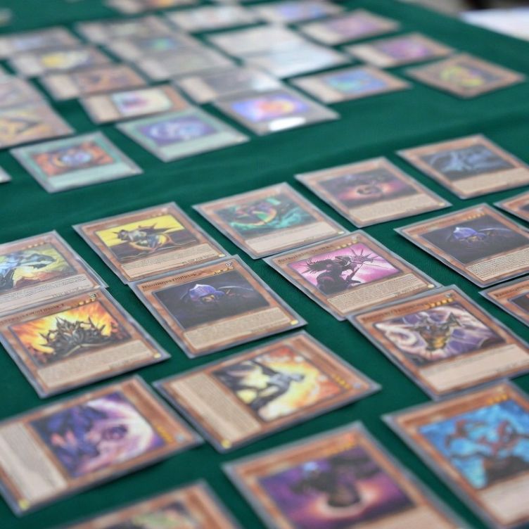 collectible trading cards in protective sleeves on a tournament table